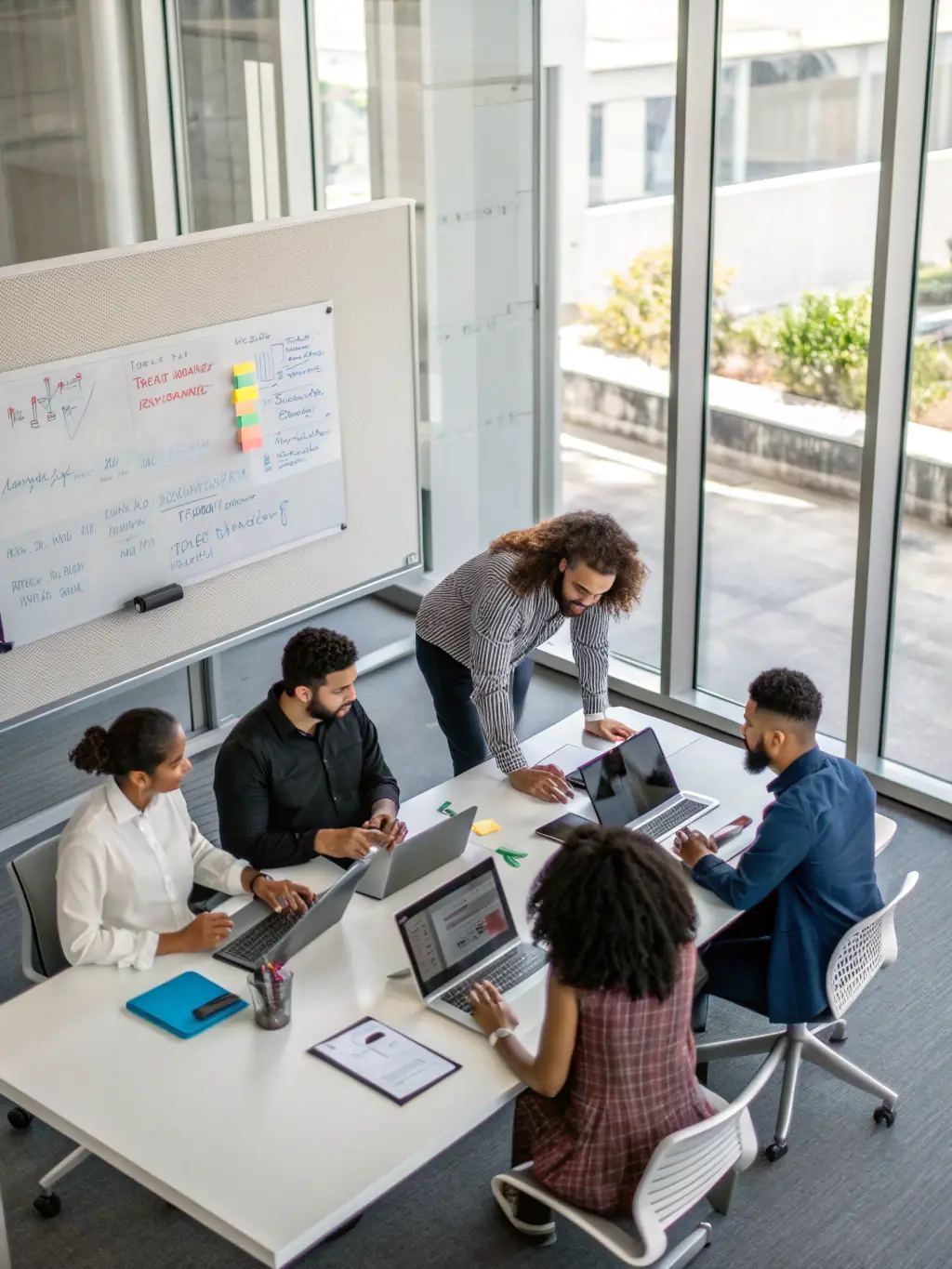A team of IT professionals collaborating in a modern office, representing improved collaboration and communication through reliable infrastructure.